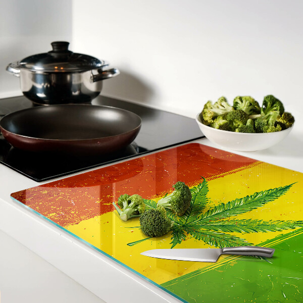 Szklana deska kuchenna Liść konopi na kolorowym tle