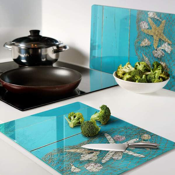 Szklana deska kuchenna Muszle i gwiazdy morskie w siatce