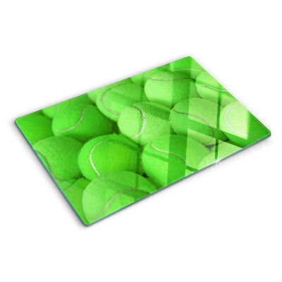 Snijplanken glas Tennisballen op een groene achtergrond