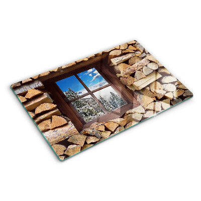 Snijplanken van glas Uitzicht op een winterlandschap door het raam.