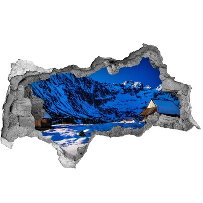 3D sticker gat in stenen muur Winterhuisje in de bergen