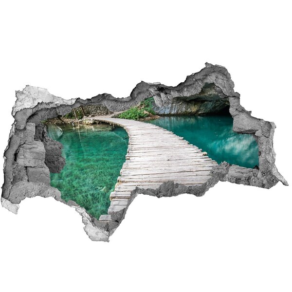 3D sticker gat in stenen muur Mysterieuze brug over turkooizen water