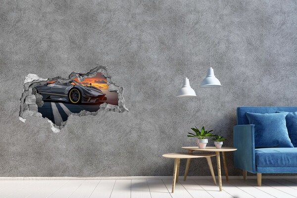 3D sticker gat in stenen muur Een raceauto op het circuit.