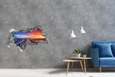 3D muursticker gescheurde muur Zonsondergang boven de pier