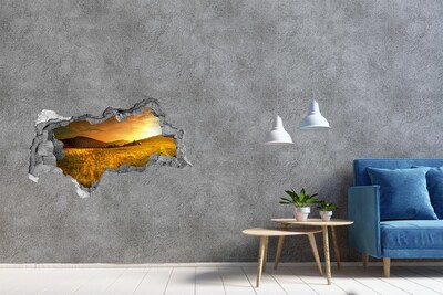 3D muursticker gescheurde muur Gouden weide bij zonsondergang
