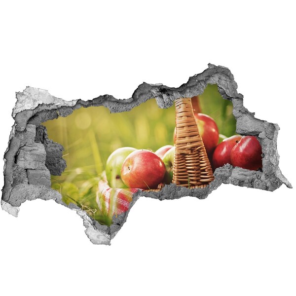 3D sticker gat in stenen muur Een mand met appels in de natuur