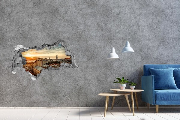 3D sticker gat in stenen muur Zonsondergang boven de stad