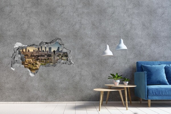 Wandsticker 3D doorkijk Uitzicht op Warschau door een gat in de muur.
