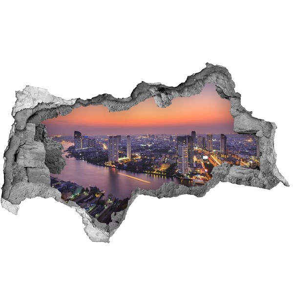 3D muursticker gescheurde muur Uitzicht op de stad bij zonsondergang