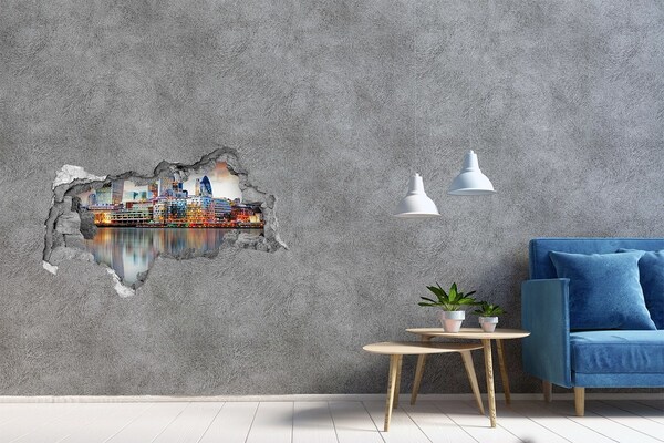 3D sticker gat in stenen muur Een uitzicht op een moderne stad aan het water.