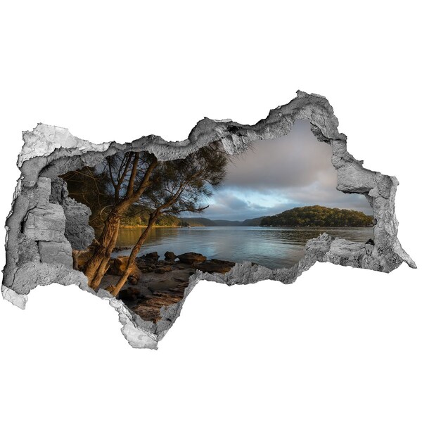 3D sticker gat in stenen muur Rust aan het water