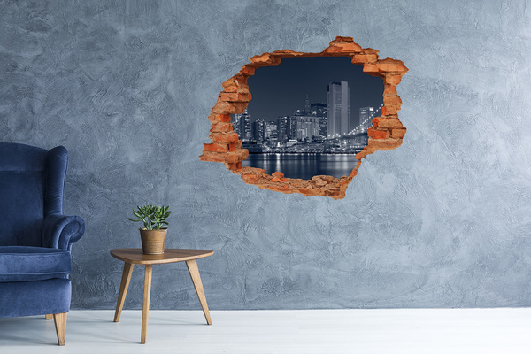 Vinyl muursticker 3D breekeffect De skyline van New York door een gat in de muur.