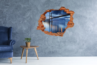 Grote 3D muursticker gat in de muur Een brug over het water in een nachtscène.