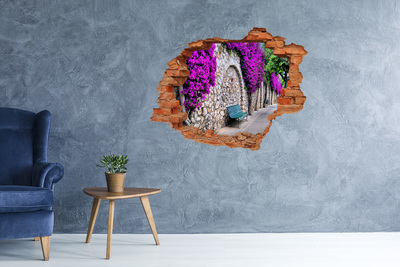 Grote 3D muursticker gat in de muur Bloemenlaan in de stenen muur