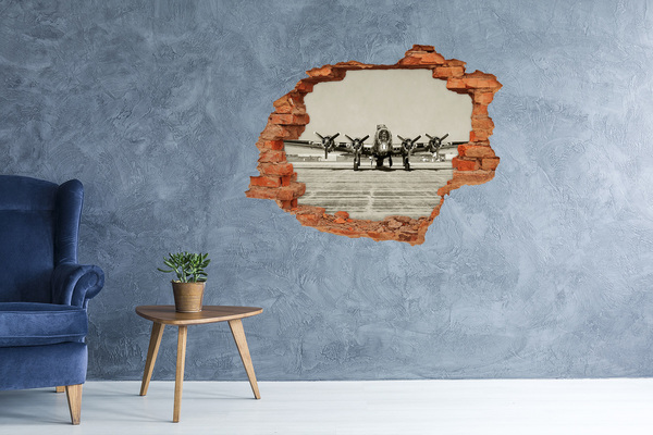 Vinyl muursticker 3D breekeffect Een oud vliegtuig op het vliegveldplatform.