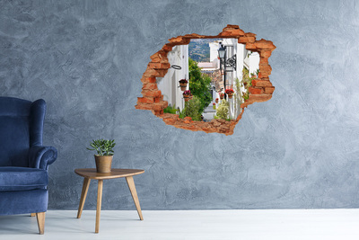 Grote 3D muursticker gat in de muur Een charmant straatje in een wit dorp