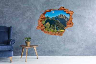 Vinyl muursticker 3D breekeffect Berglandschap door een gat in de muur