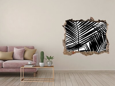 Naklejka 3D dziura na ścianę Tropikalne liście w dziurze w ścianie