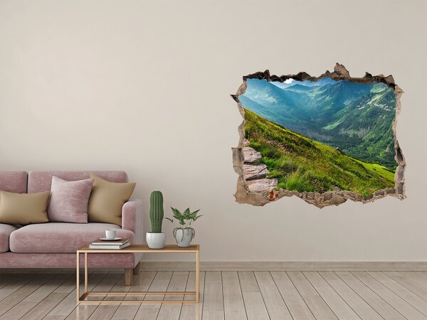 Wandsticker 3D doorkijk Berglandschap achter het gat in de muur