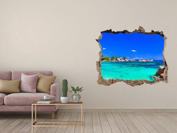 Zelfklevende muursticker 3D gat Caribisch strand door een gat in de muur