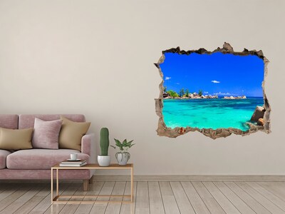 Zelfklevende muursticker 3D gat Caribisch strand door een gat in de muur