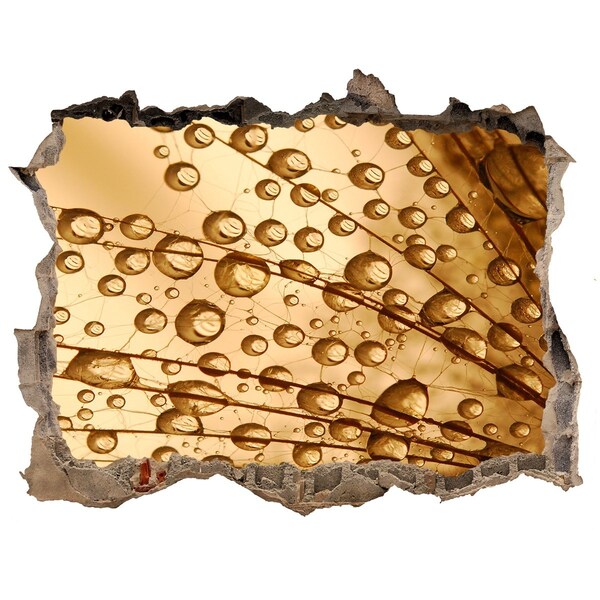 Wandsticker 3D doorkijk Een gouden druppel op een betonnen achtergrond