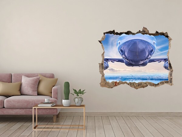 Wandsticker 3D gat met uitzicht Een vliegtuig boven de stad