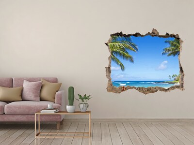 Wandsticker 3D doorkijk Caribisch strand door een gat in de muur