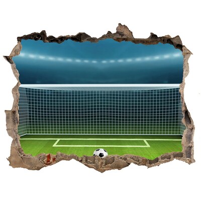 Fototapeta dziura na ścianę 3d naklejka Stadion piłkarski za dziurą w ścianie