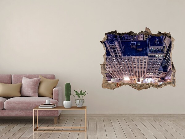Wandsticker 3D doorkijk Uitzicht op de stad 's nachts vanaf een hoger gelegen punt.