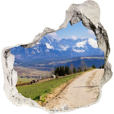 3D muursticker effect gat in de muur Berglandschap achter het gat in de muur