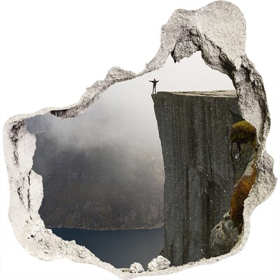 3D muursticker effect gat in de muur Uitzicht vanaf de klif boven het fjord