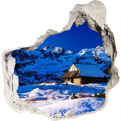 Zelfklevende muursticker 3D gat Winterhuisje in de bergen