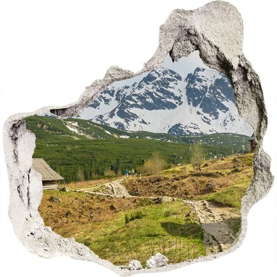 3D muursticker effect gat in de muur Berglandschap met een dorp