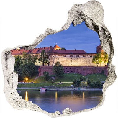 3D muursticker effect gat in de muur Een kasteel aan de rivier in het nachtelijke landschap
