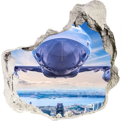 3D muursticker effect gat in de muur Een vliegtuig boven de stad