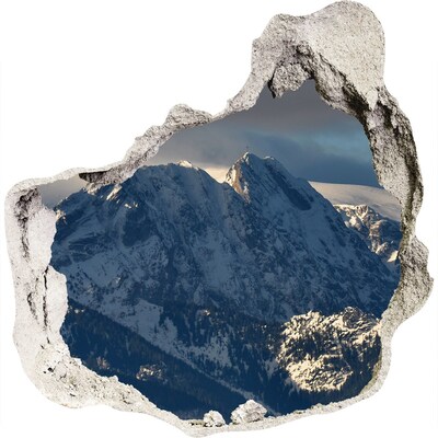 3D muursticker effect gat in de muur Bergen in winterlandschap