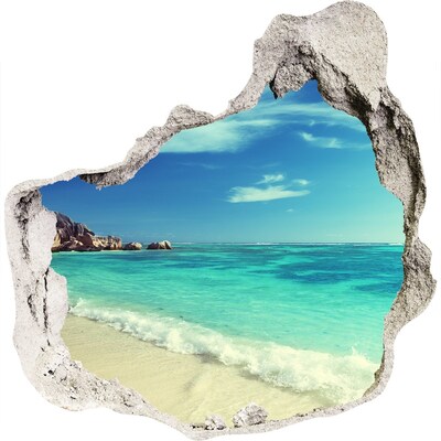 Zelfklevende muursticker 3D gat Caribisch strand door een gat in de muur