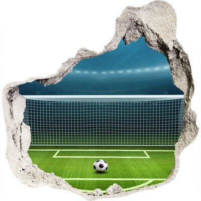 zelfklevende trapfolie Het voetbalstadion achter het gat in de muur.