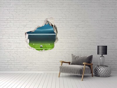 zelfklevende trapfolie Het voetbalstadion achter het gat in de muur.