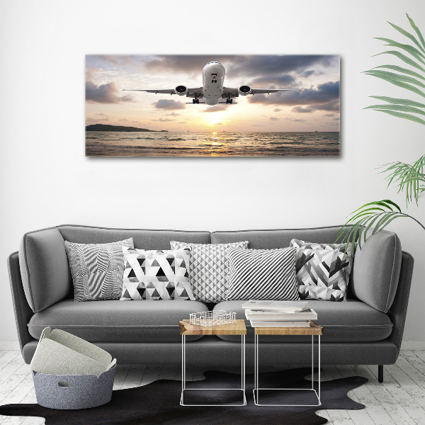 Plexiglas schilderij Een vliegtuig boven de zee