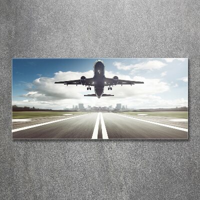 Schilderij op acrylglas Een vliegtuig dat opstijgt