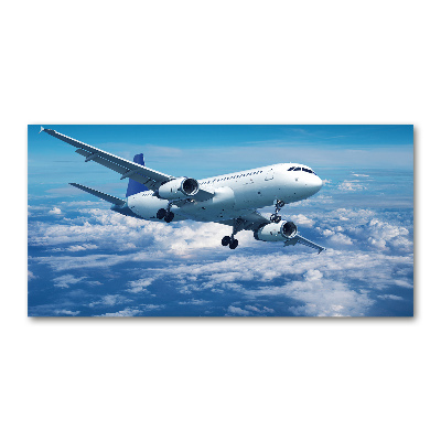 Foto in plexiglas Een vliegtuig in de wolken