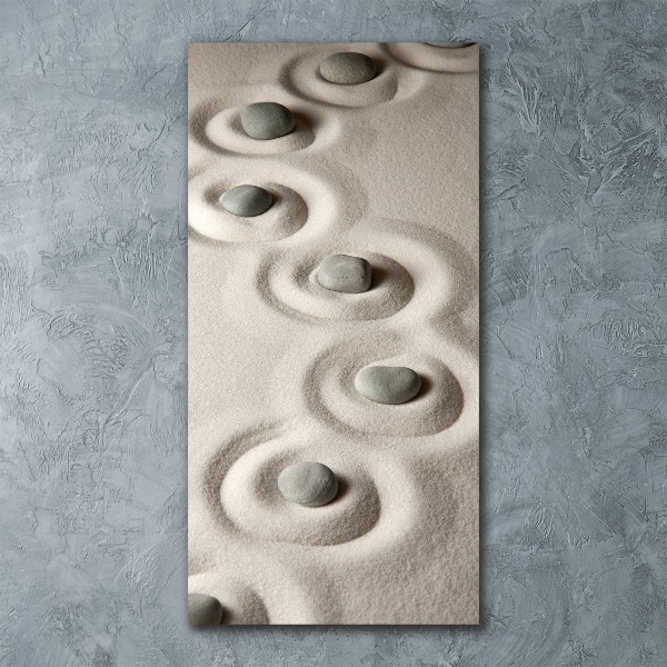 Foto obraz szkło akryl pionowy Kamienie na piasku