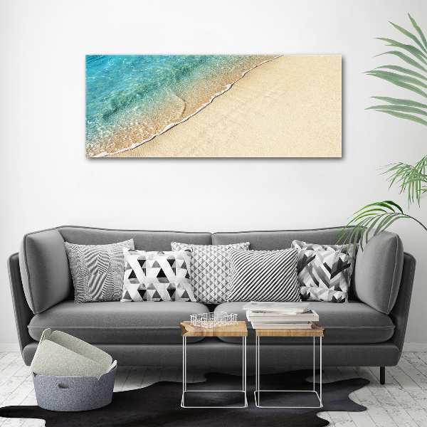 Foto canvas Een golf op het strand