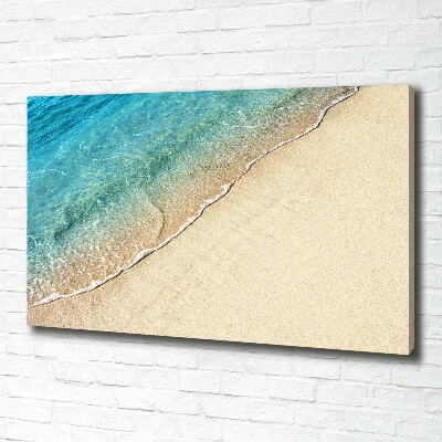 Foto canvas Een golf op het strand