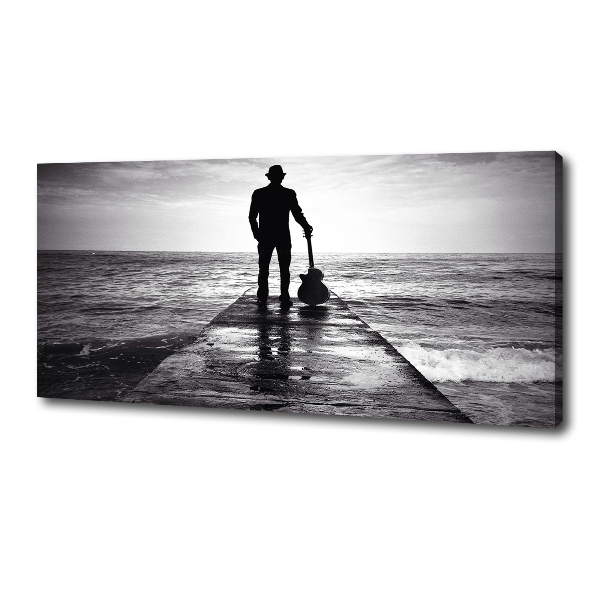 Canvas foto Gitarist op de pier