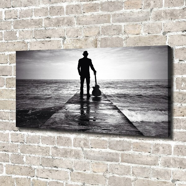 Canvas foto Gitarist op de pier