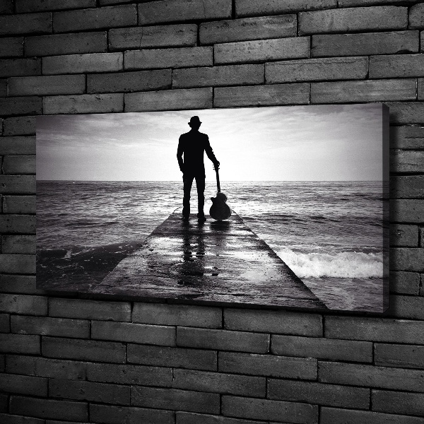Canvas foto Gitarist op de pier