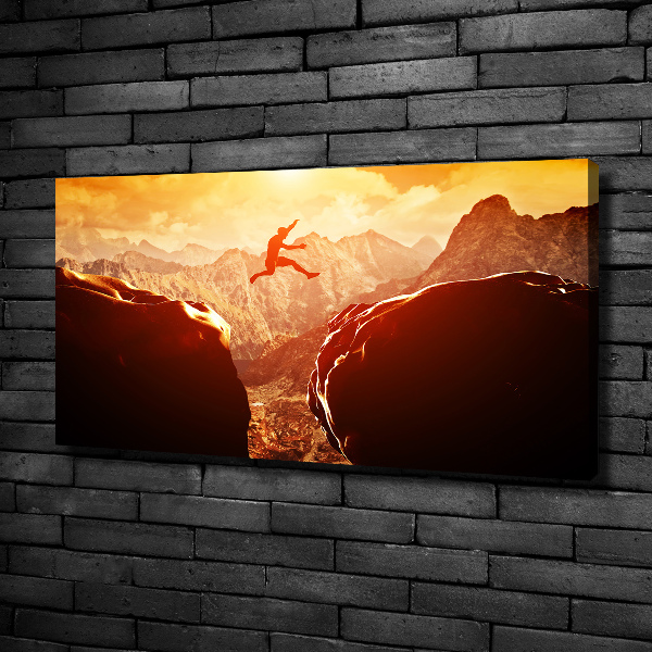 Canvas foto Spring over de afgrond